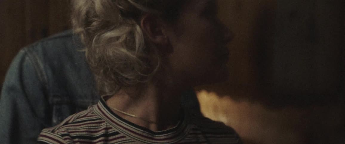 A woman and man are standing in a room together