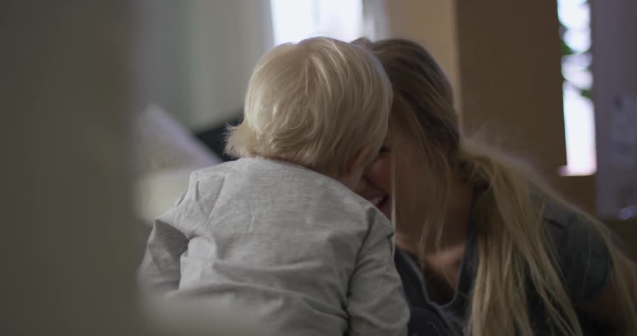 An adult playing with a child