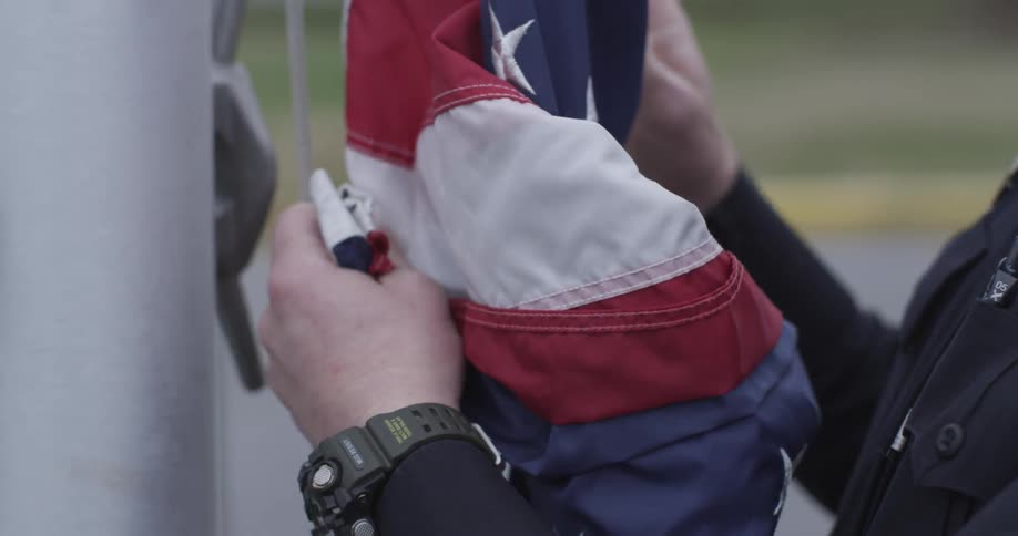 An american flag is unfolded