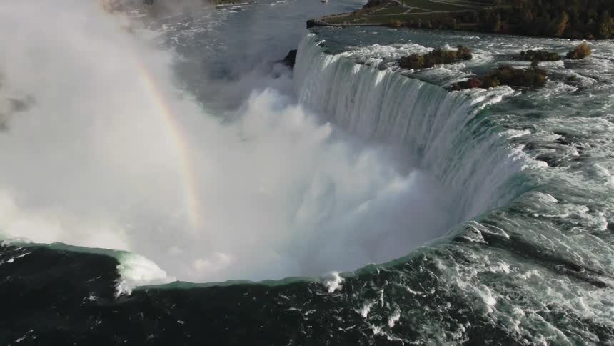 Waterfalls crashing over the edge of a cliff