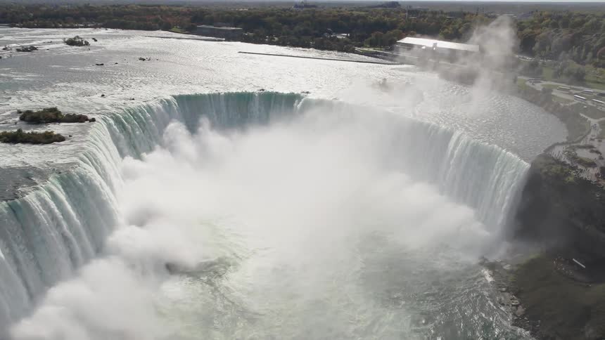 The waterfall is pouring into the stream