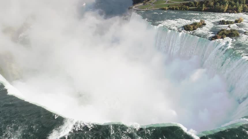 The rapids splash down from the rocks