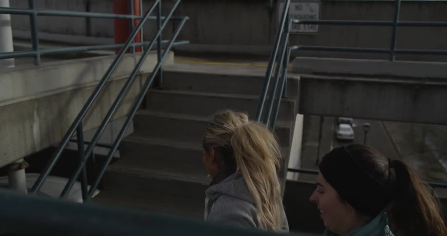 People running up  flight of stairs