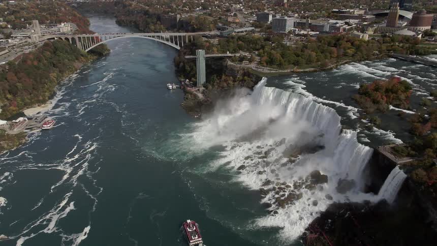 An aerial view of a dam and city