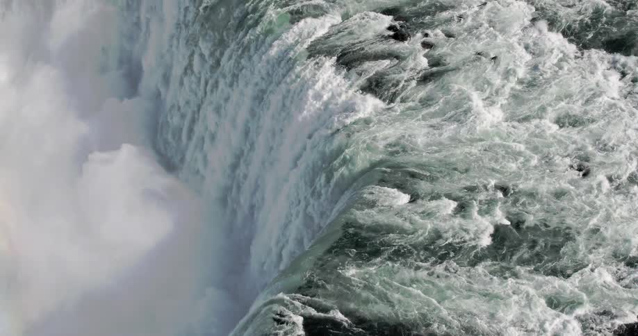 A waterfall crashing over the ledge