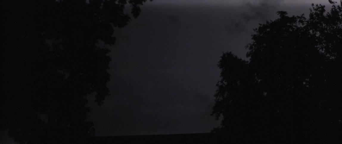 The lightning flashes in the clouds above