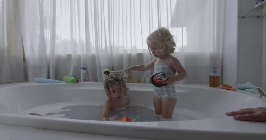 Children playing at the bathtub