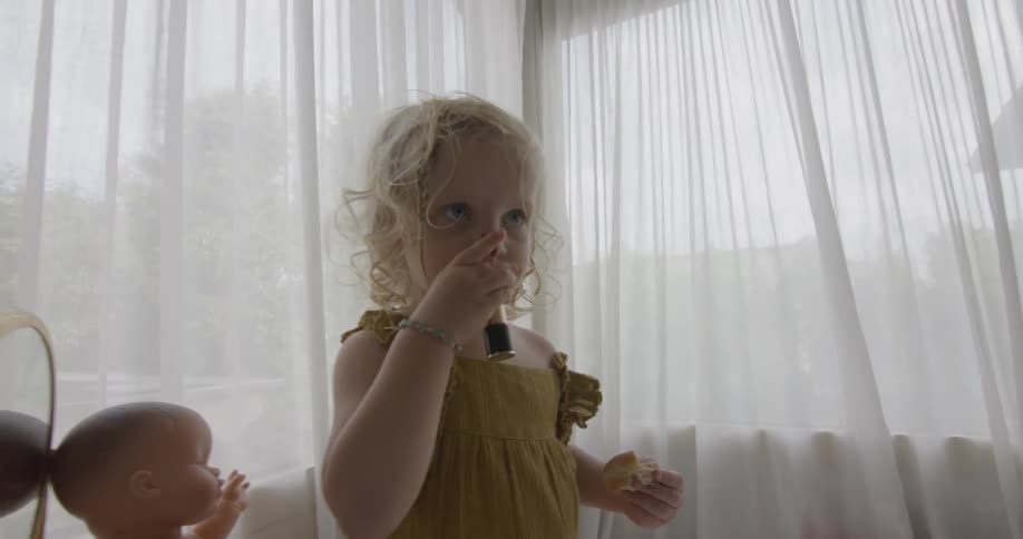A girl playing in the bedroom