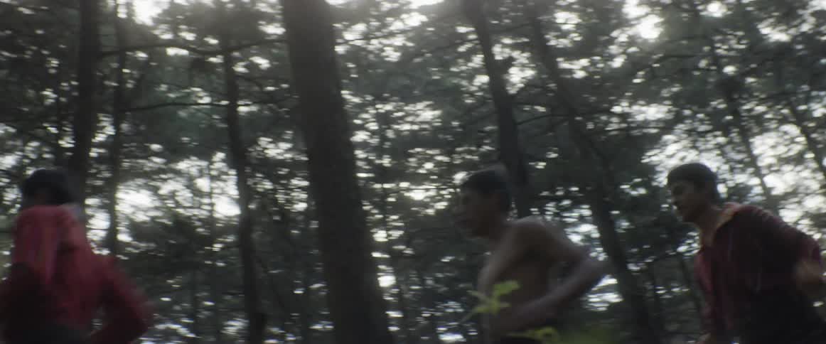 A group of man running at the forest