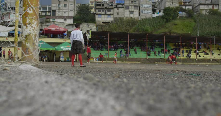 A group of kids playing soccer
