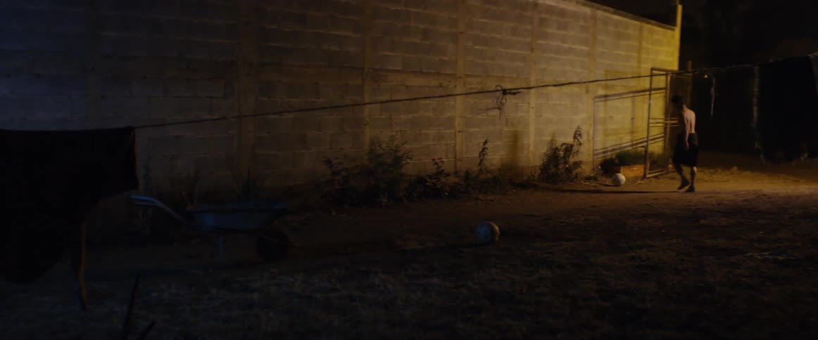 Kid playing in the alley