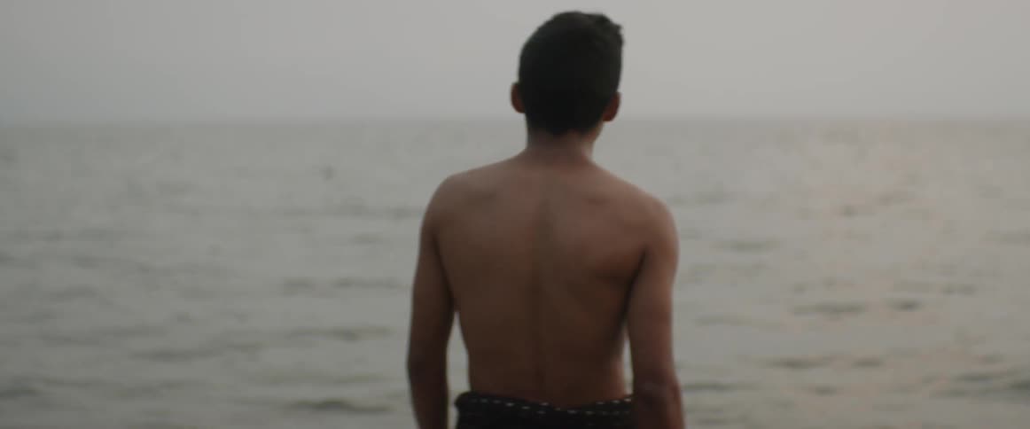 A man walks into the ocean