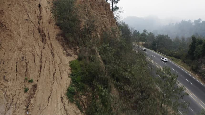 An aerial view of a road near a cliff