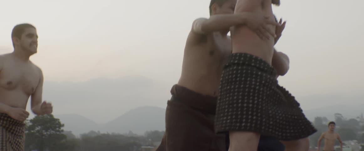 A group of shirtless man playing