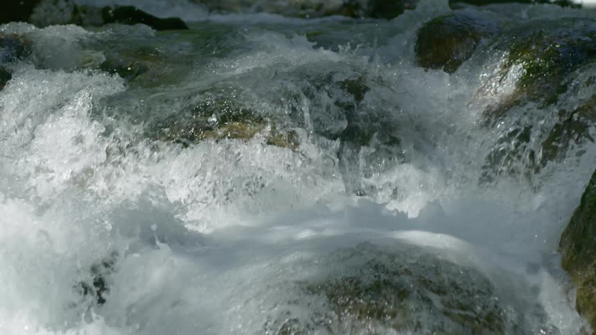 The rapids crash over the rocks