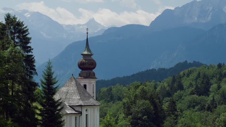 A church and steeple in the trees