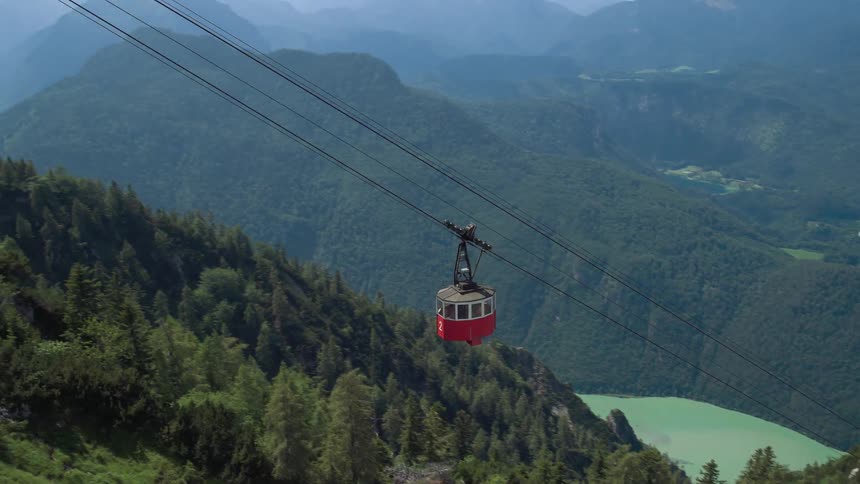 A view of a cable car climbing up to the mountain