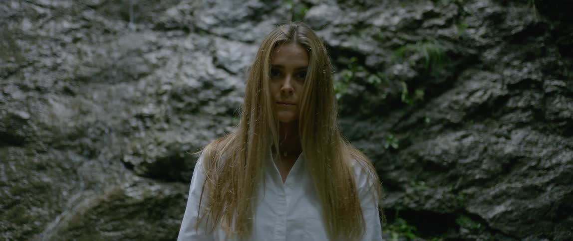 A portrait of female with white shirt in the nature