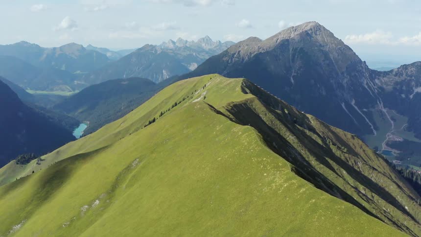 A green ridge and slope in a mountain range