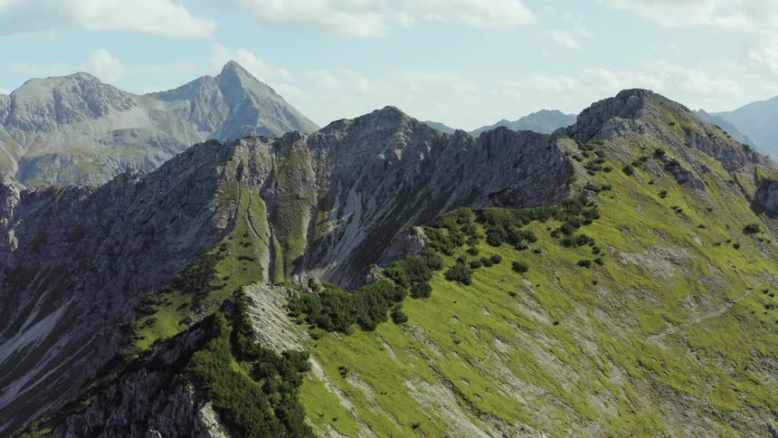 An aerial view of a mountain range in the wilderness