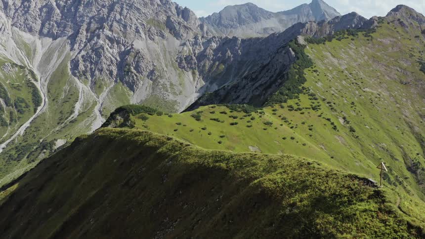 There is a cross at the top of the mountain