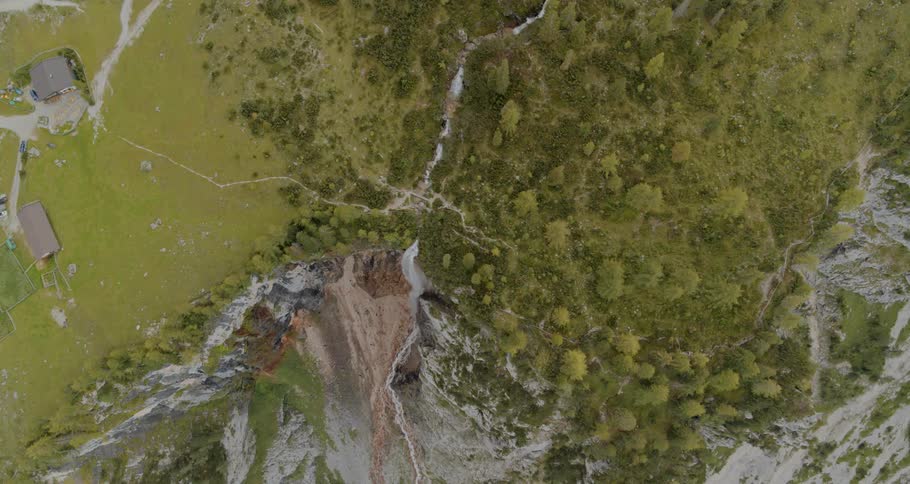 An aerial view of a forest with Waterfall