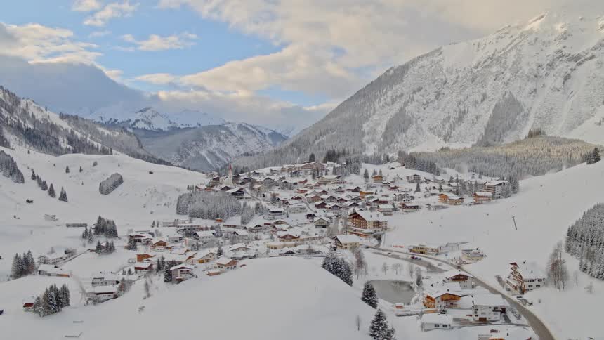An aerial view of a snowy village