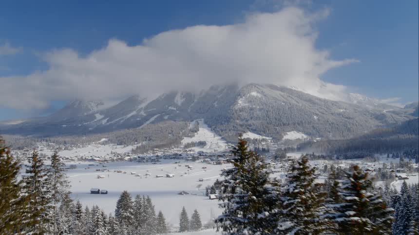 An aerial view of a mountain snow