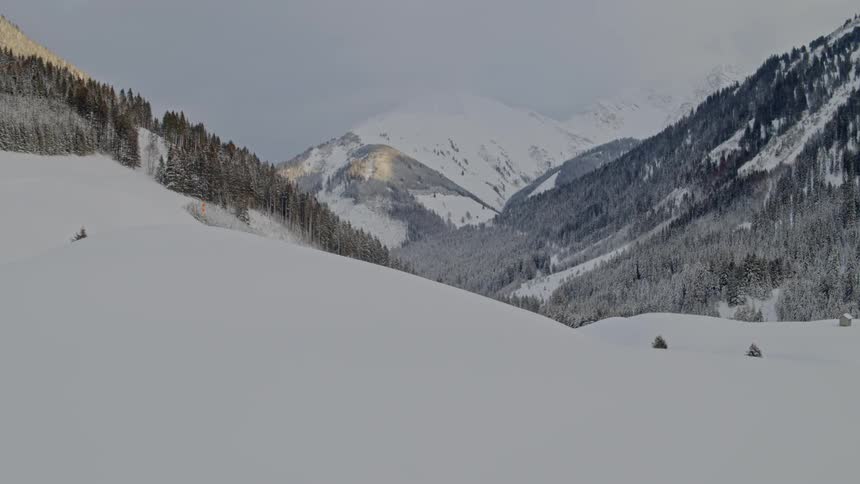 An aerial view of a snowy mountain