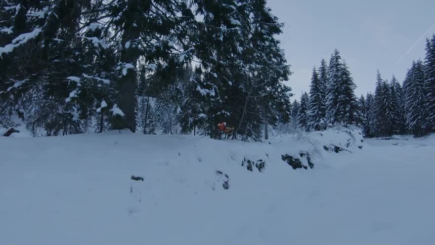 A man skiing at the mountain snow field