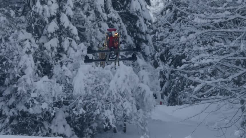 A footage of a drone flying at the snowy forest
