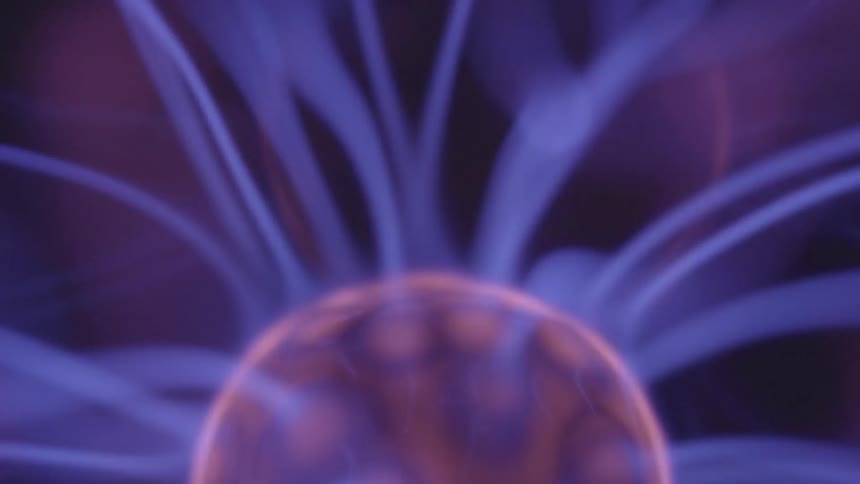 Purple lights shoot out from a round red object