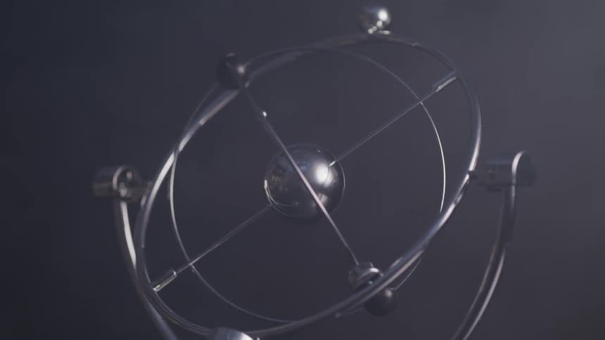 A kinetic orbital toy spinning