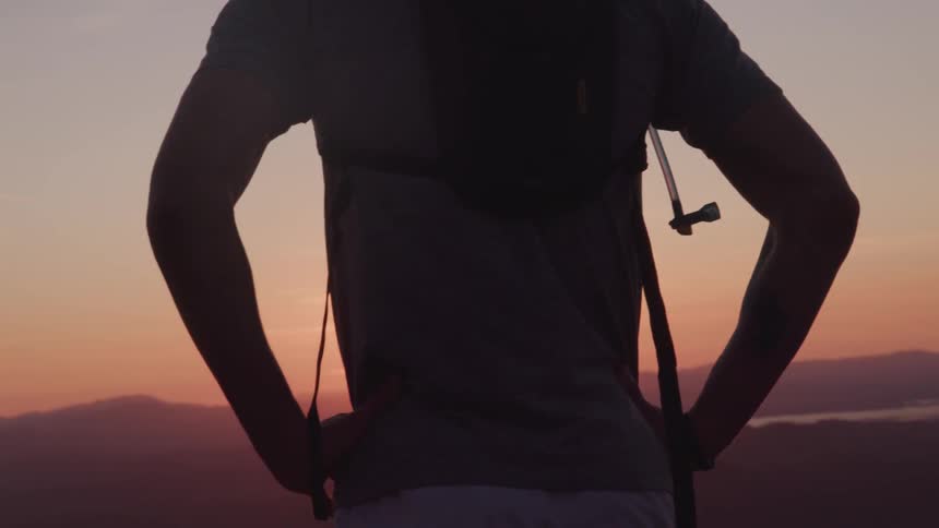 A silhouette of a man standing