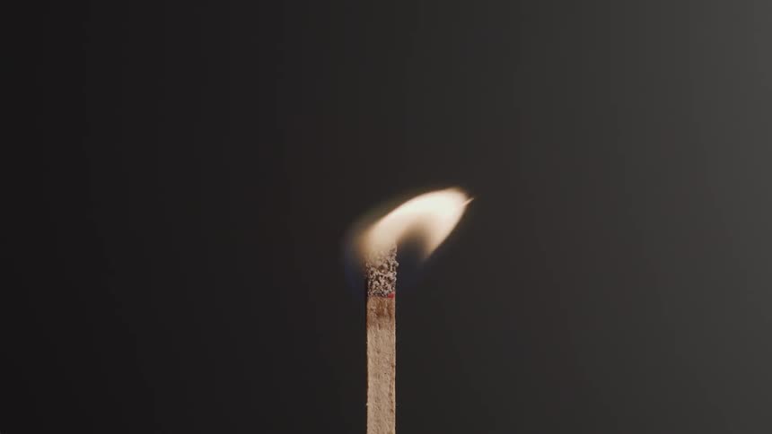 A match lights and burns down