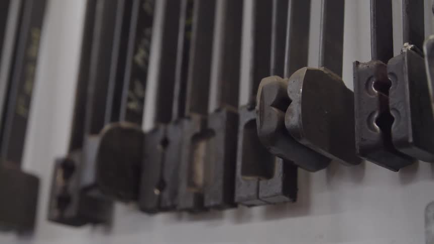 Tools hang from a wall