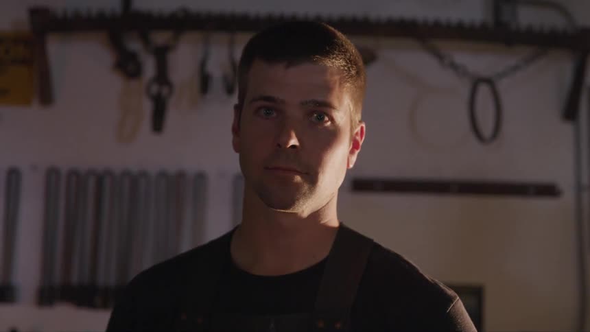 A man is standing in a room