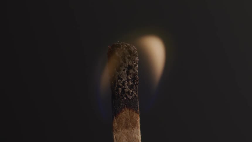 A burning match is extinguished