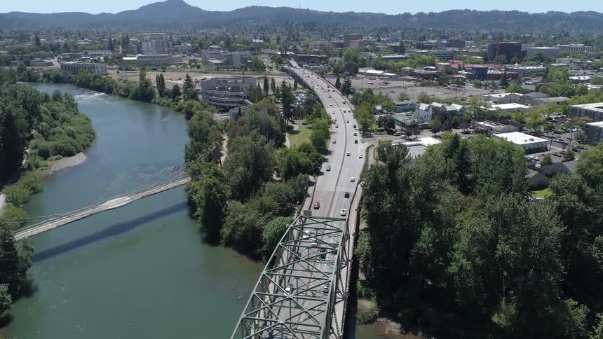 Time lapse of cars driving across a bridge and in a city