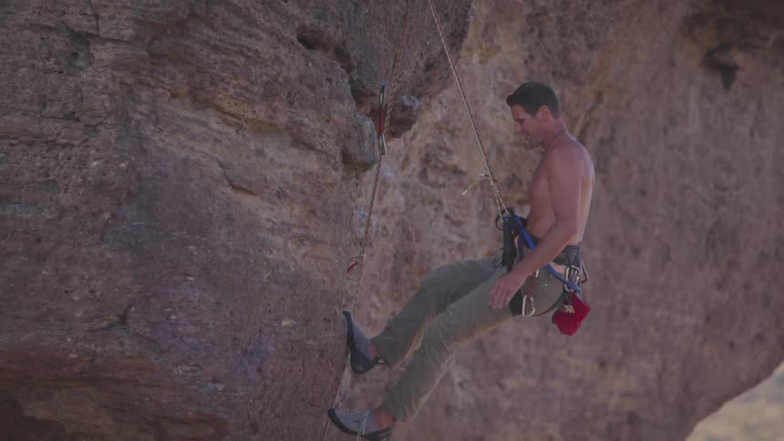 A man down climbing at the cliff