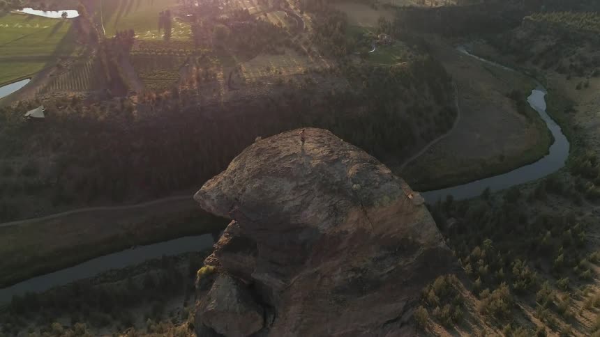 A man on the top of the mountain