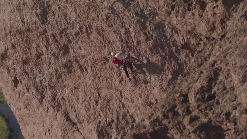 A man is climbing a mountain