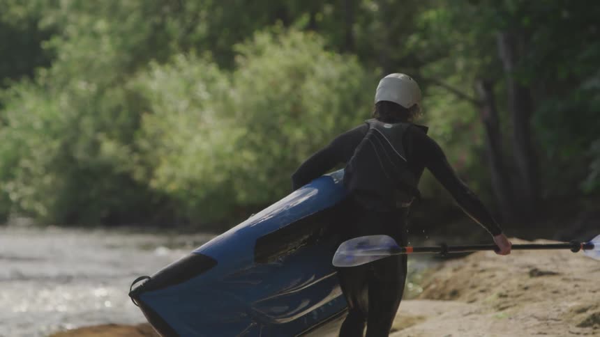 A man bringing a canoe