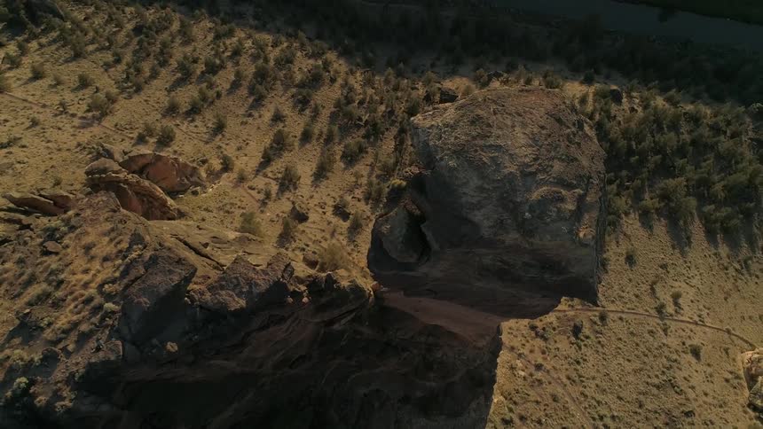 A rock tower rises high above the valley floor