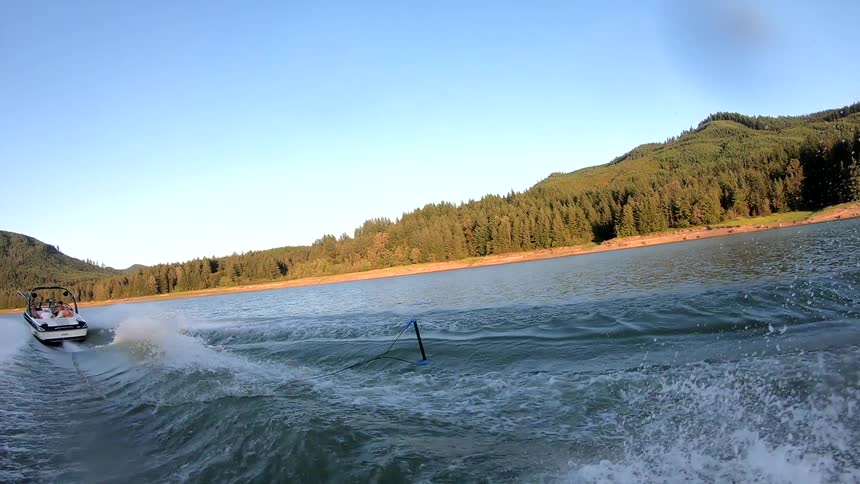 A man doing an extreme sport at the lake