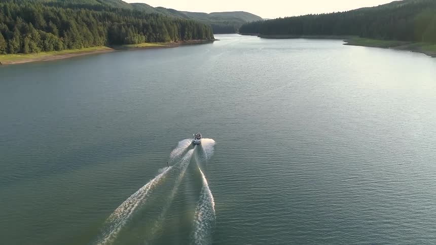 Aerial shot of a boat in a river