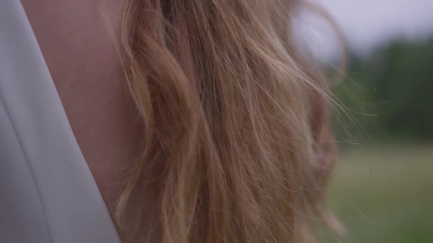 Girls hair blowing in breeze