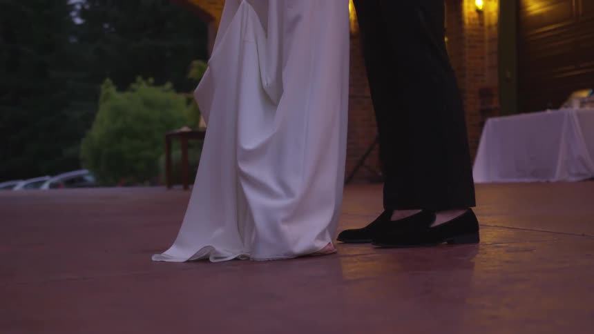 Bride and groom dance at wedding reception