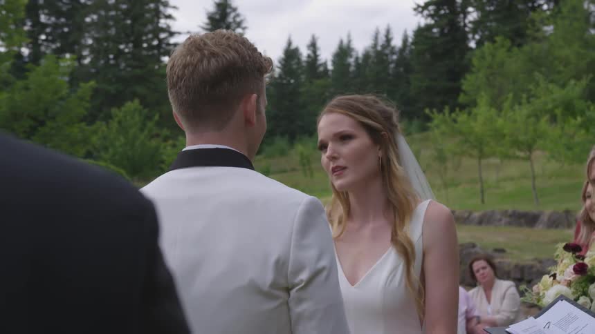 A bride and maid look at each other at the wedding