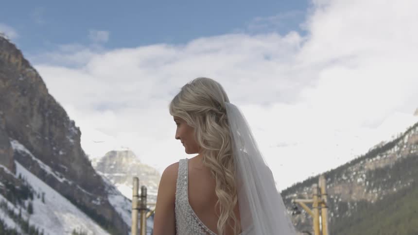 A portrait of a bride at the snowy mountain